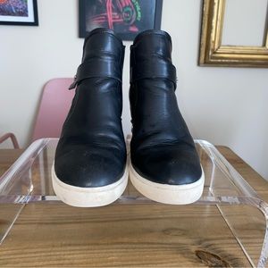 Black leather heeled sneakers